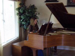 Daughter-playing-grand-piano