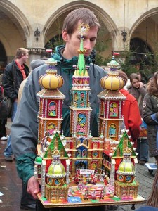 Man carrying nativity scene or szopka in Krakow Poland