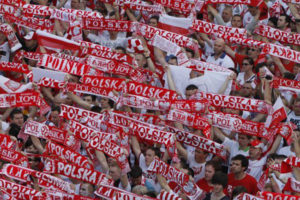 Polish soccer fans converge in the fan zone in the center of Warsaw to watch the first match of the Euro 2012 soccer championship between between Poland and Greece, in Warsaw, Poland, Friday, June 8, 2012.(AP Photo/Czarek Sokolowski)