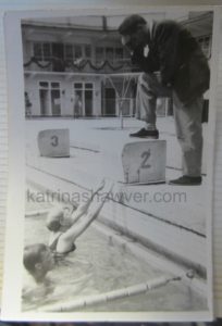 Henry Zguda coaches young swimmers.