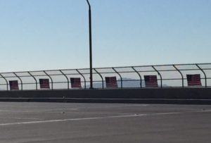 Flags on a freeway bridge, Spetember 11, 2016