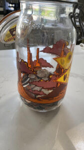 pennies and coins in a jar